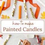 Painted candles with orange ribbon