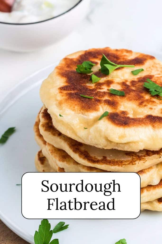 sourdough flatbreads on white plate.