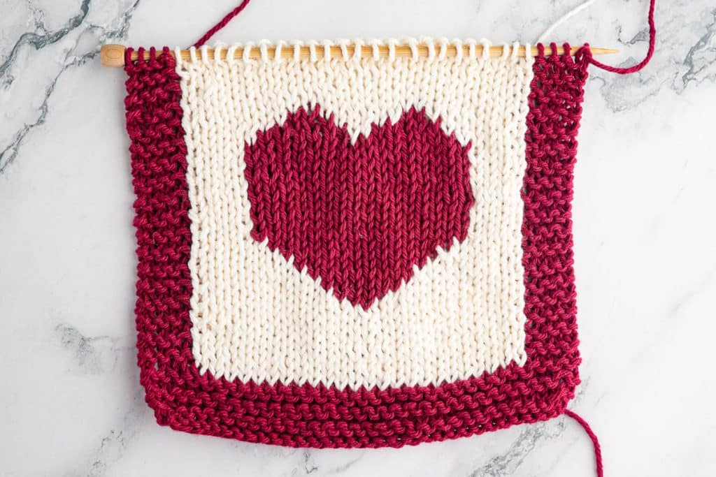 Knitting heart pot holder.