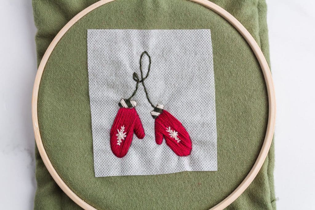 Embroidering mittems.