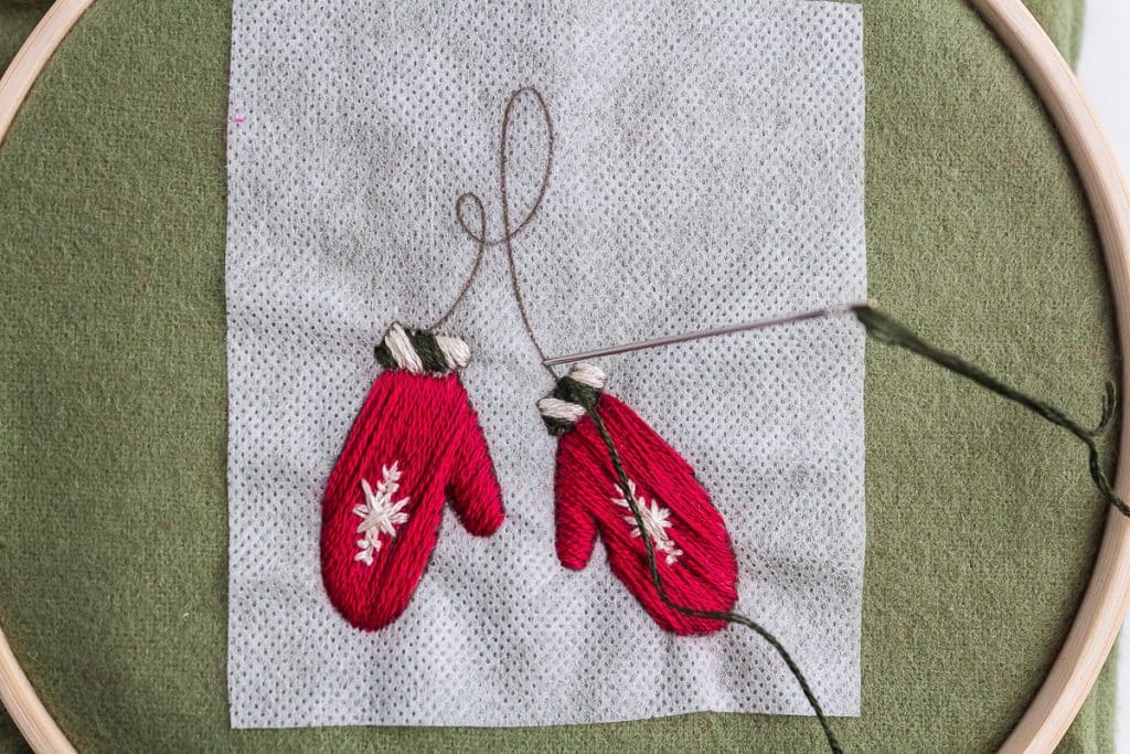 Embroidering mittems.