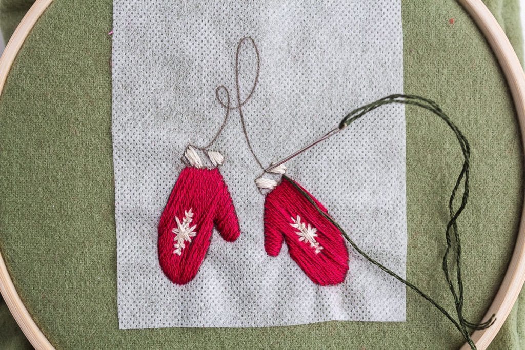 Embroidering mittems.