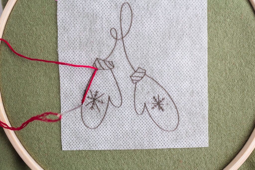 Embroidering mittems.