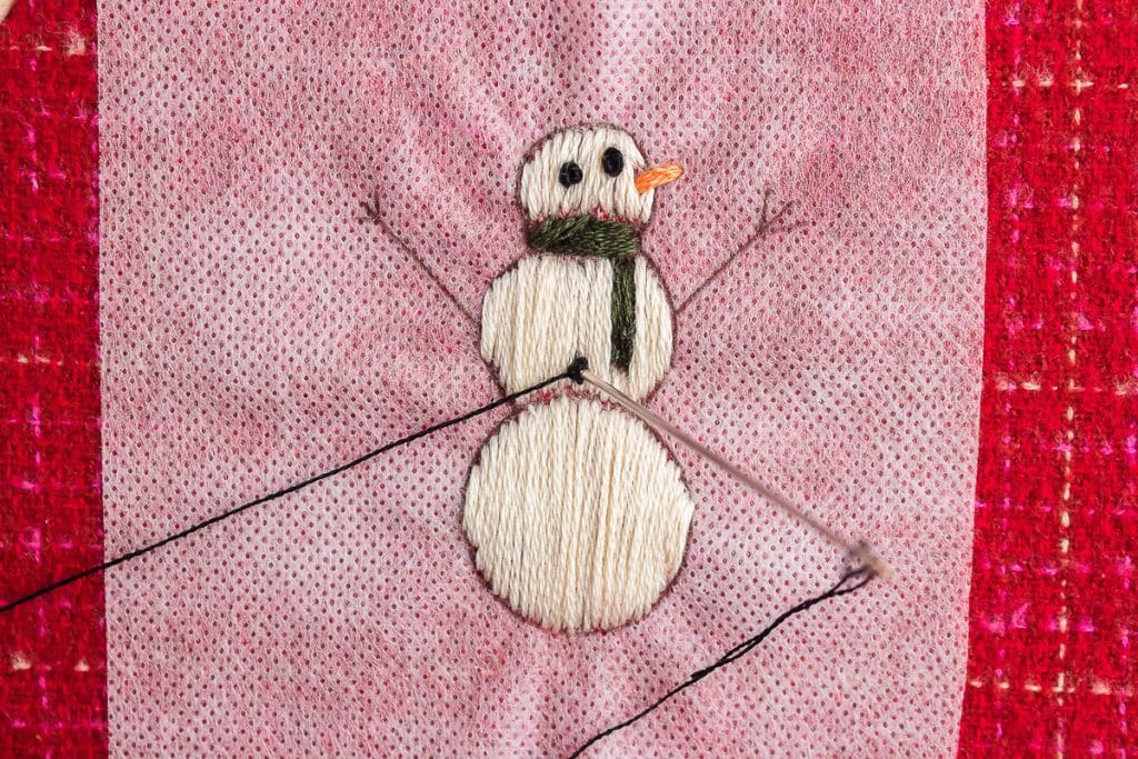 sewing body of snowman.