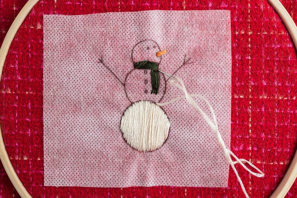 sewing body of snowman.