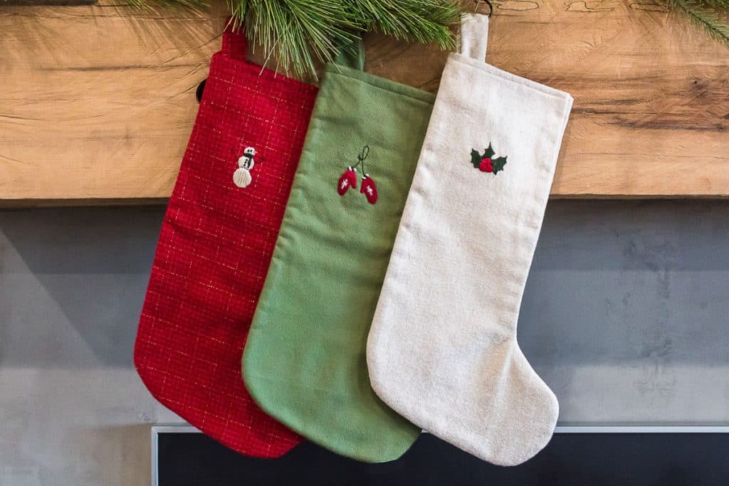 Christmas stockings hanging at a mantle.