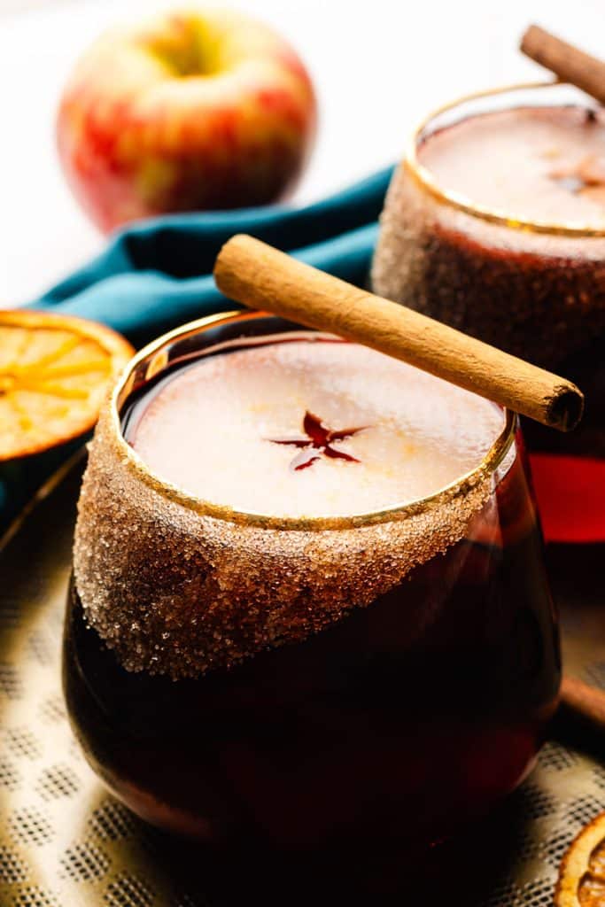 Winter sangria with apple slices and cinnamon stick.