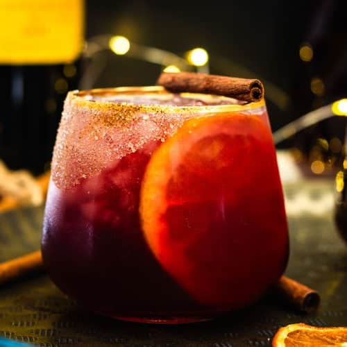 Winter sangria with oranges and cinnamon stick.