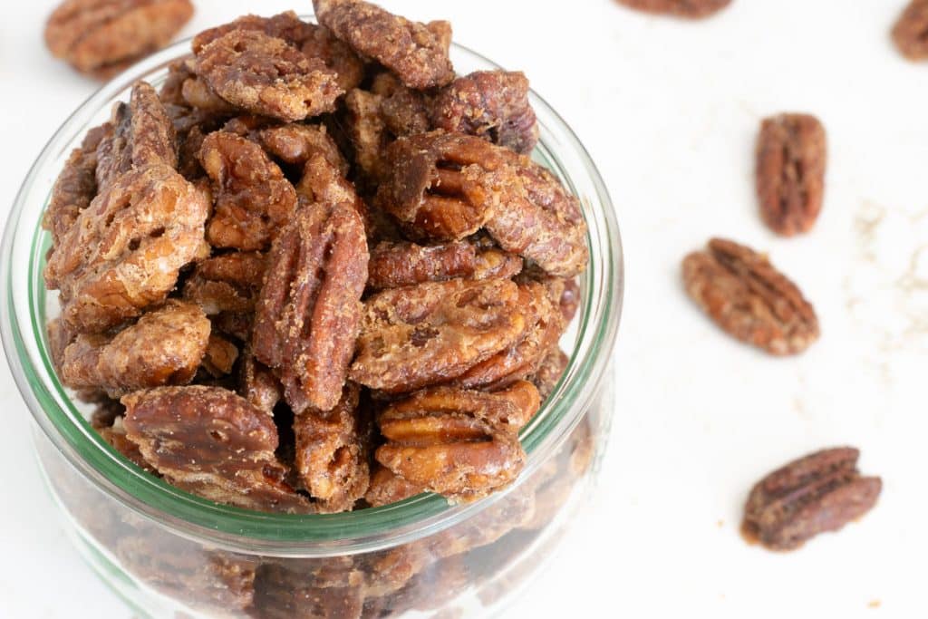 Bourbon pecans in a glass jar.