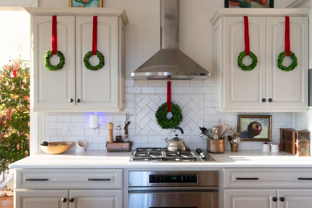 wreaths on kitchen cabinets.