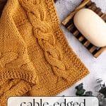 Cable-edged knit dishcloth.