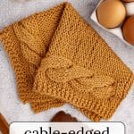 Cable-edged knit dishcloth.