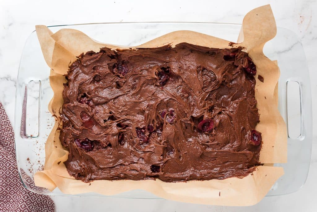 Brownie batter in parchment paper.