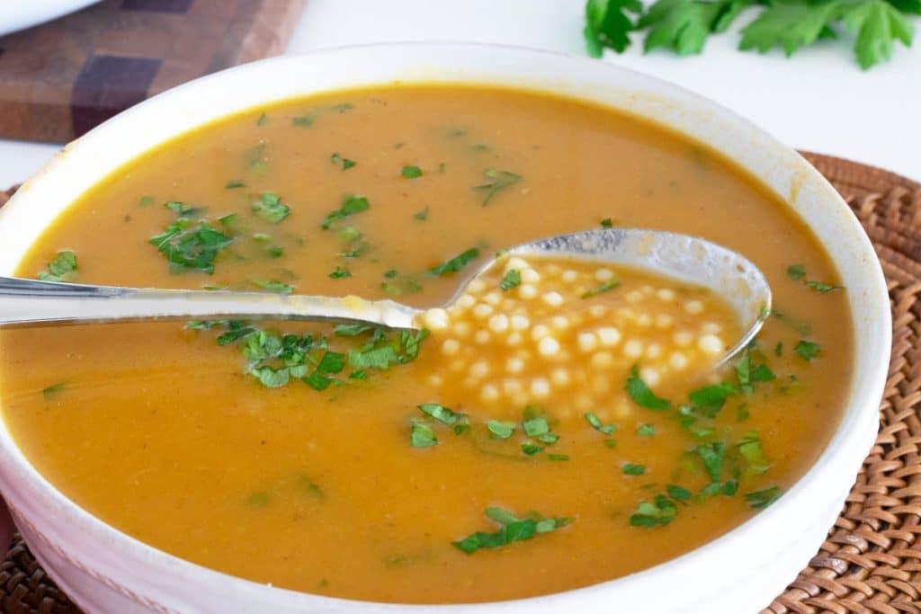 Italian Pastina Soup in white bowl.