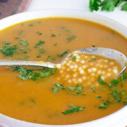 Italian Pastina Soup in white bowl.