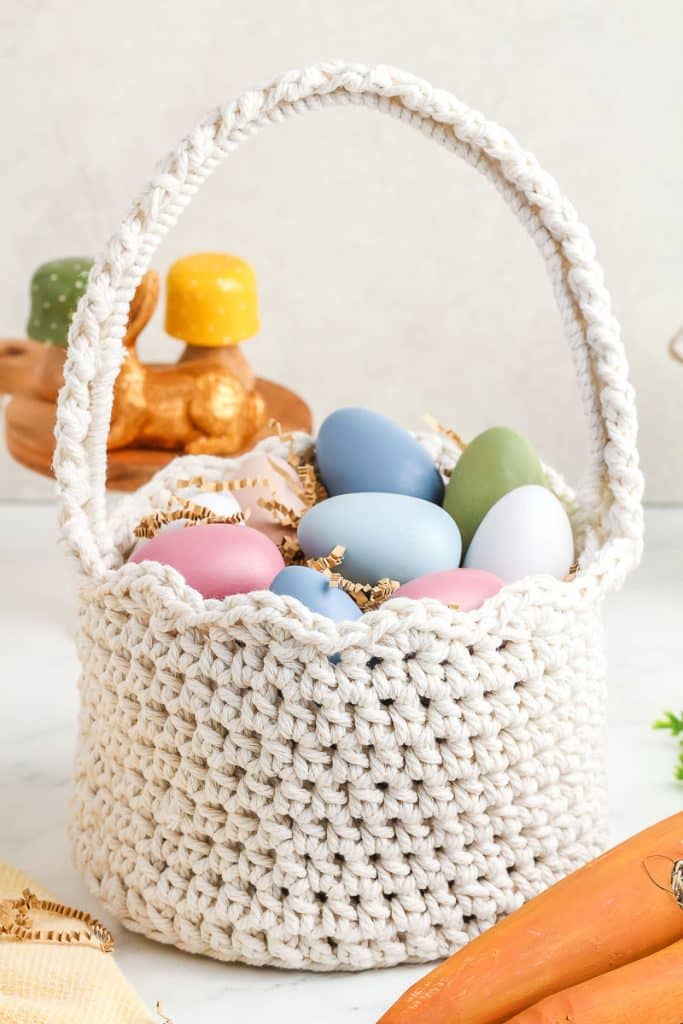 Crocheted Easter Basket filled with pastel Easter eggs.
