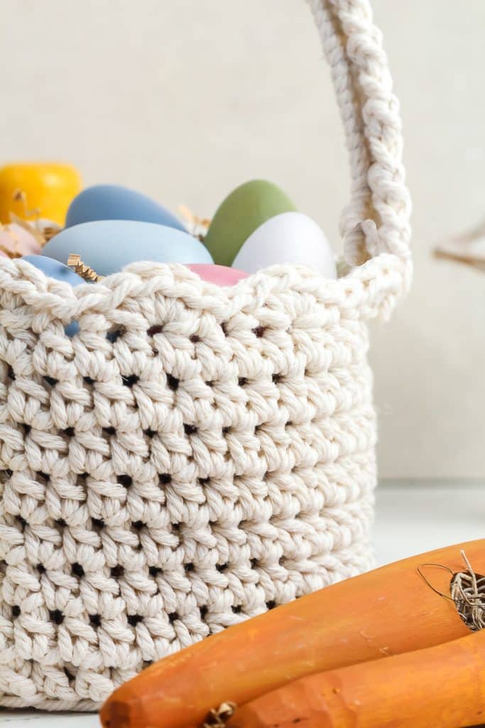 Crocheted Easter Basket filled with pastel Easter eggs.