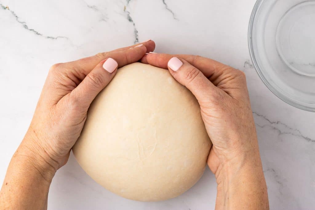 shaping dough with your hands.