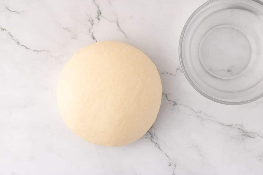 shaping dough with your hands.