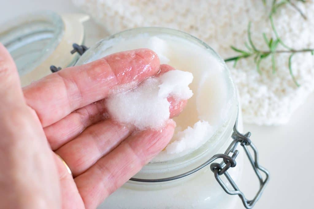 Homemade sugar scrub on fingers