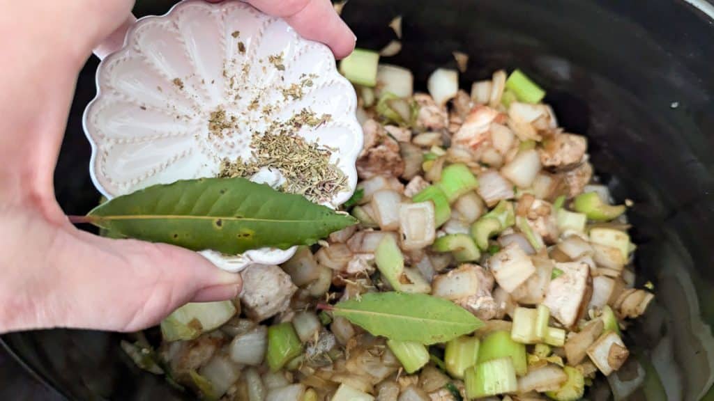 add herbs to pork, celery and onions.