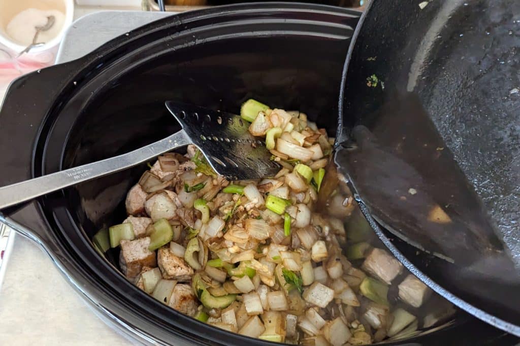 add onions and celery to seared pork.