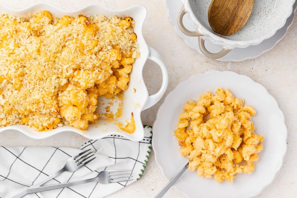 Mac and cheese in casserole and on plate.