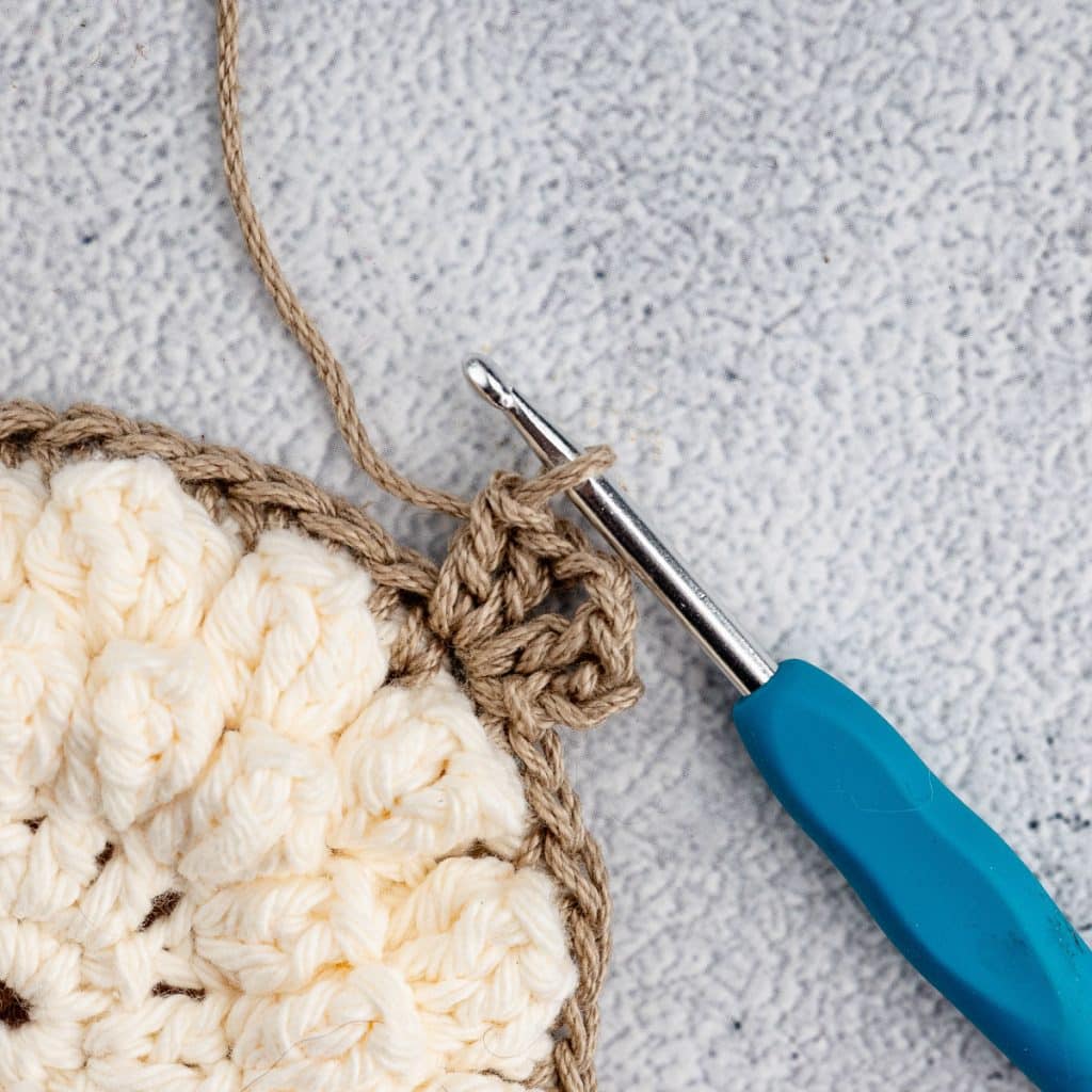 Crocheting granny square.
