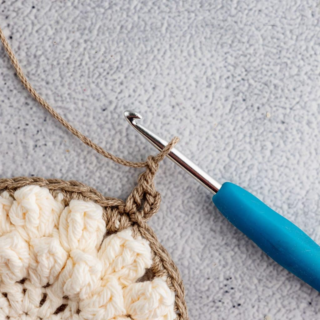 Crocheting granny square.