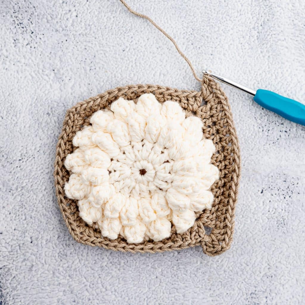 Crocheting granny square.