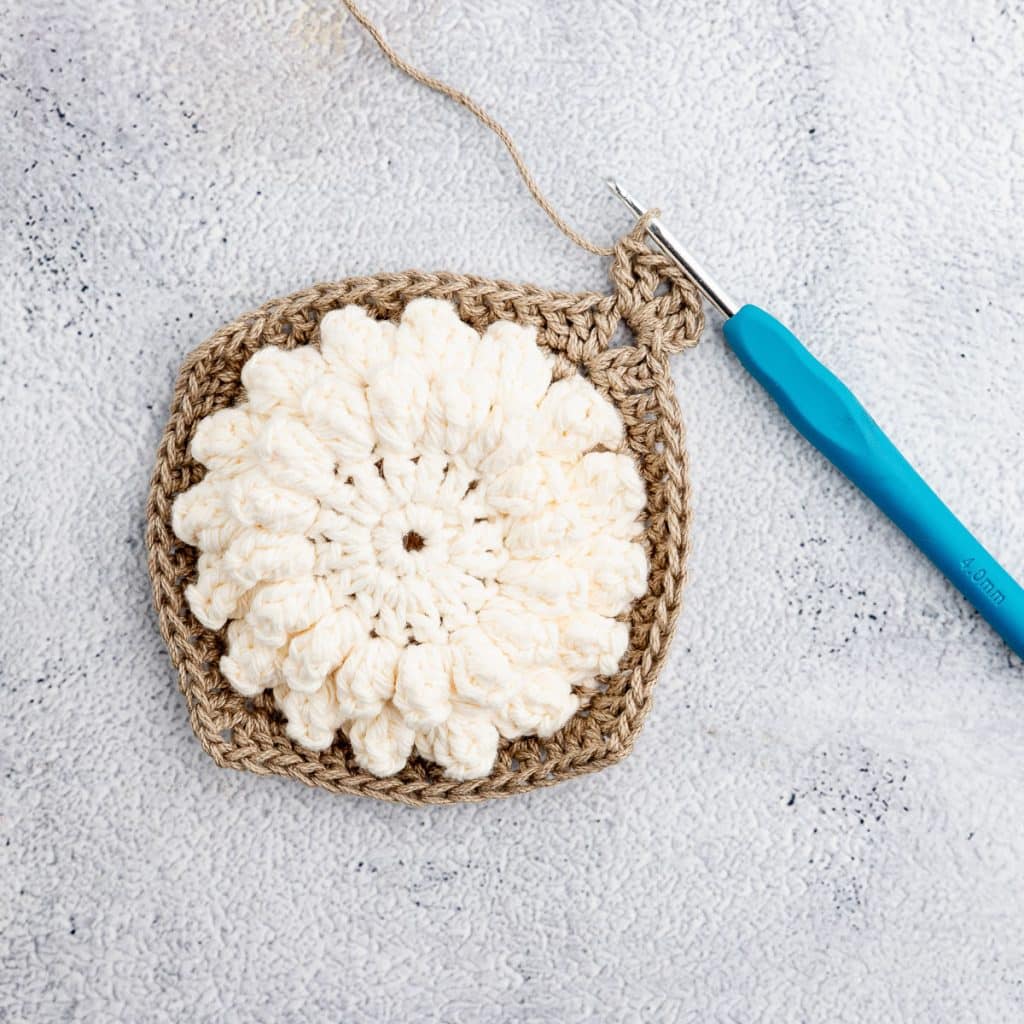 Crocheting granny square.