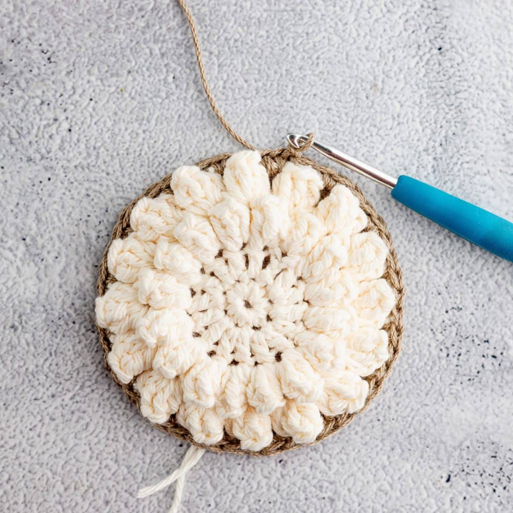 Crocheting granny square.