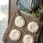 Woman with Crochet purse made with this free crochet purse pattern.