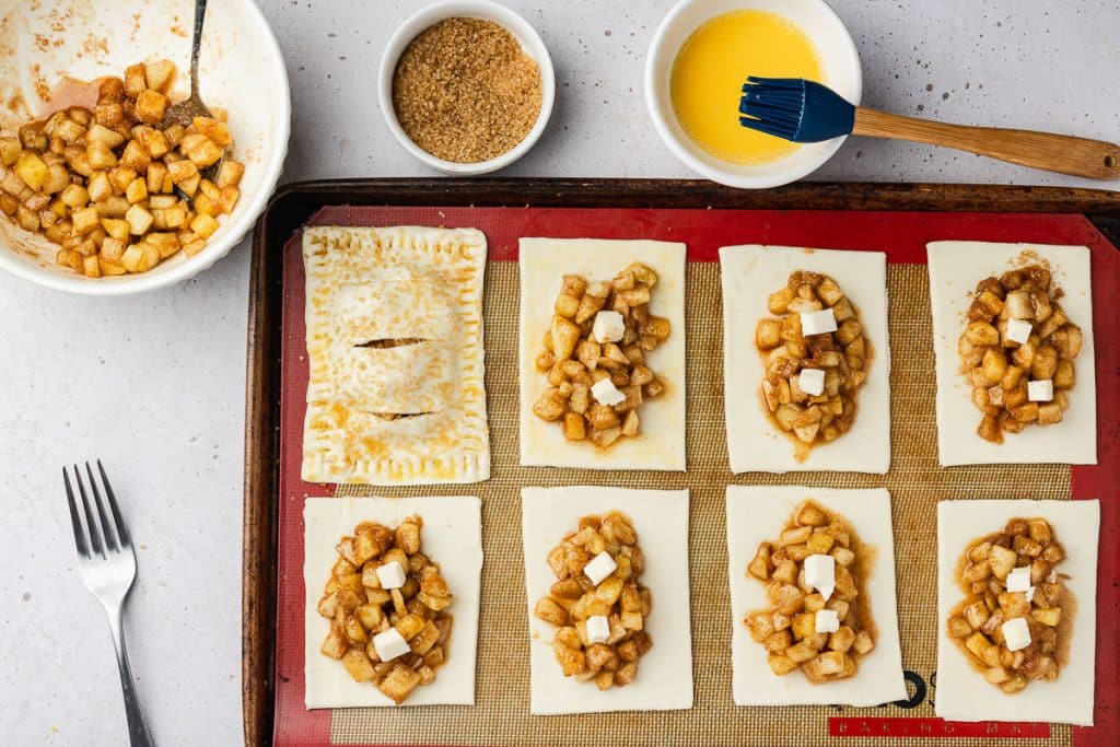 Egg wash and putting tops of puff pastry on.