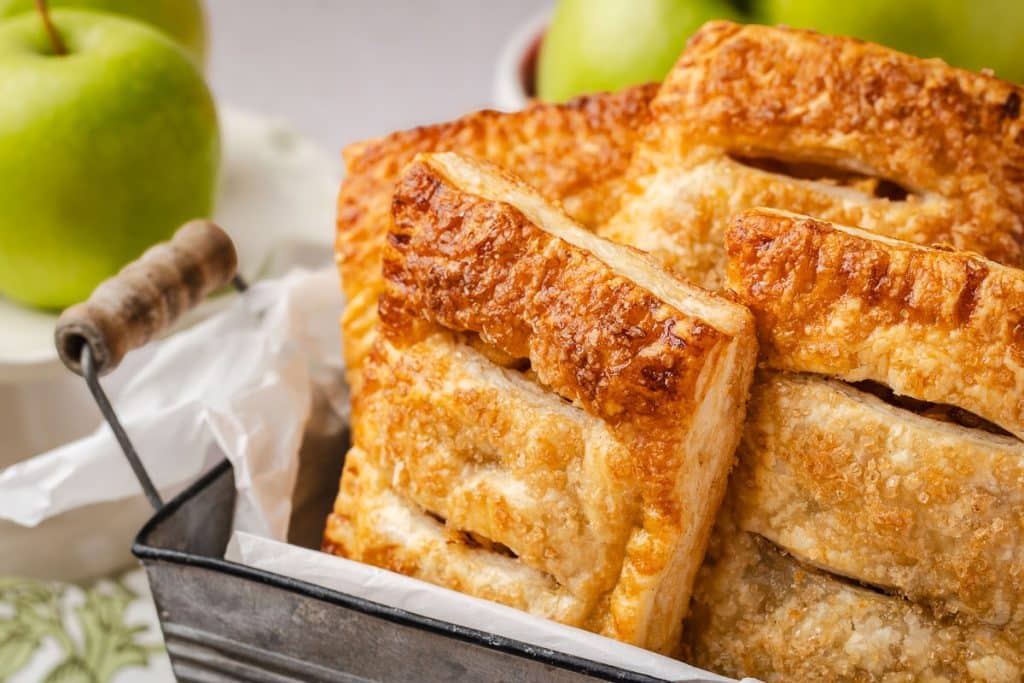 Apple PUff Pastry handpies in a basket.