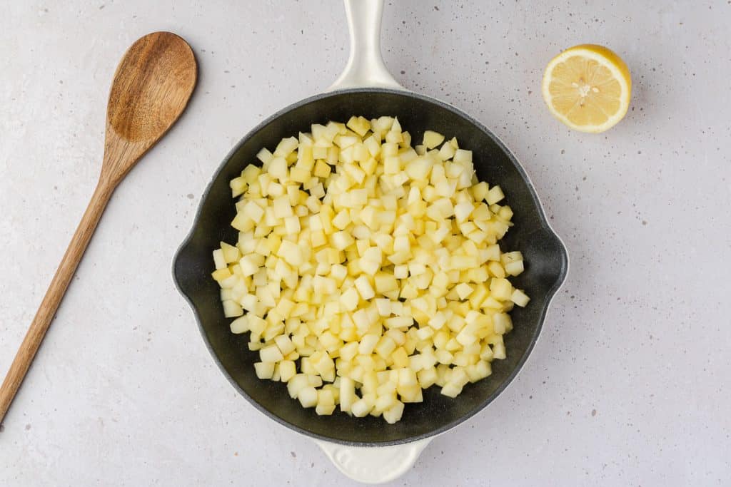 cooked apples in a skillet.