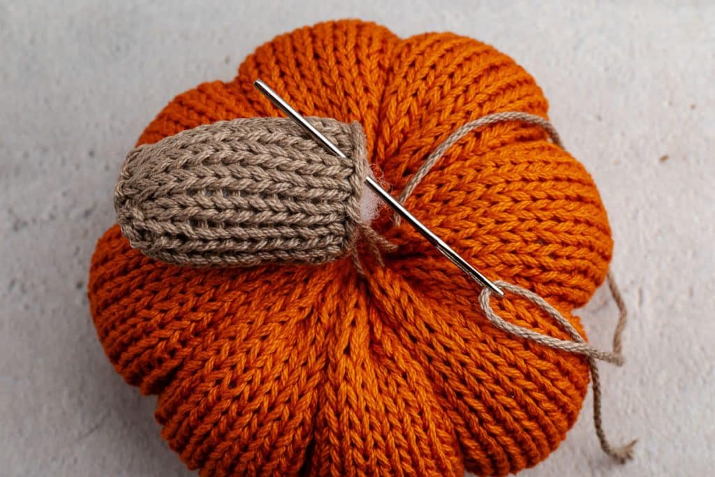 Stuff stem and sew on to pumpkin.
