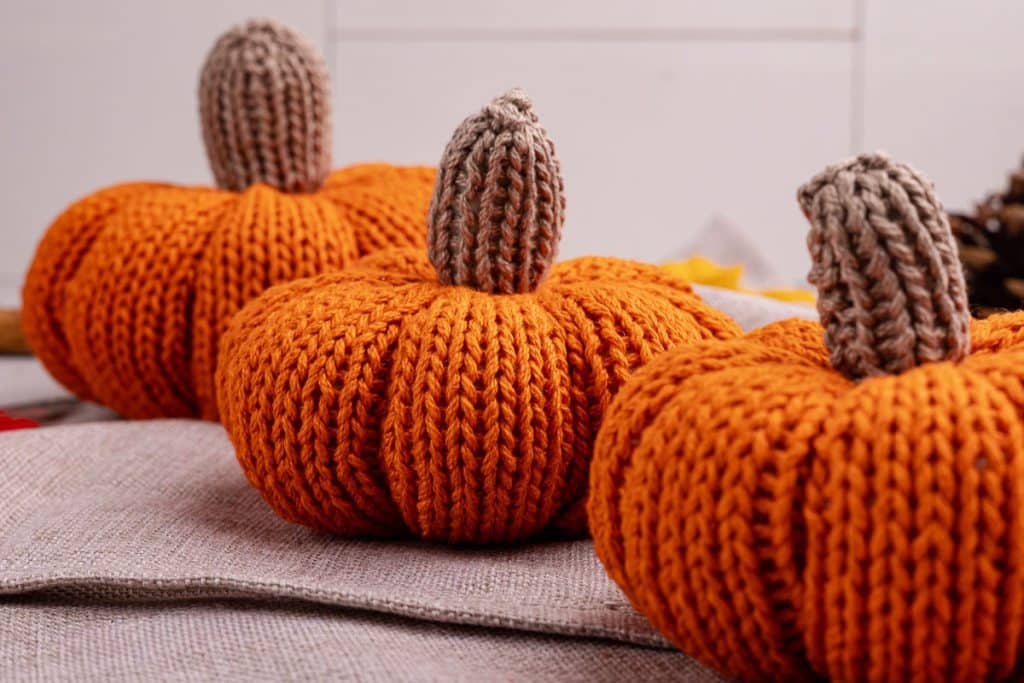 three knit pumpkins.