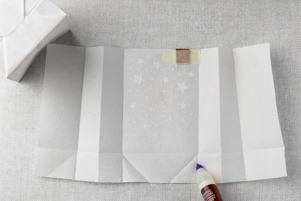 Gluing bottom of bag.