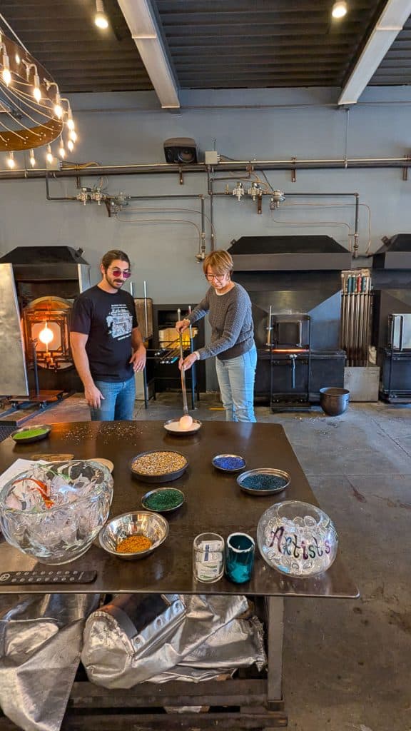 woman rolling glass into flakes.