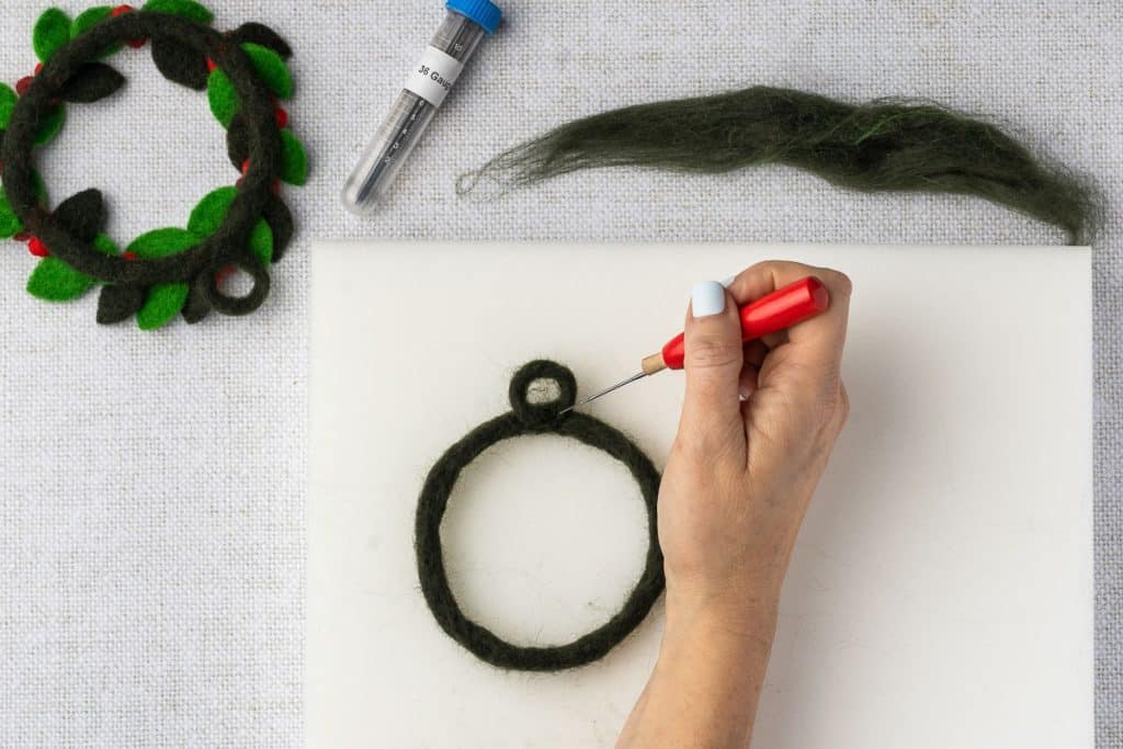 Attach hanging loop to wreath base.