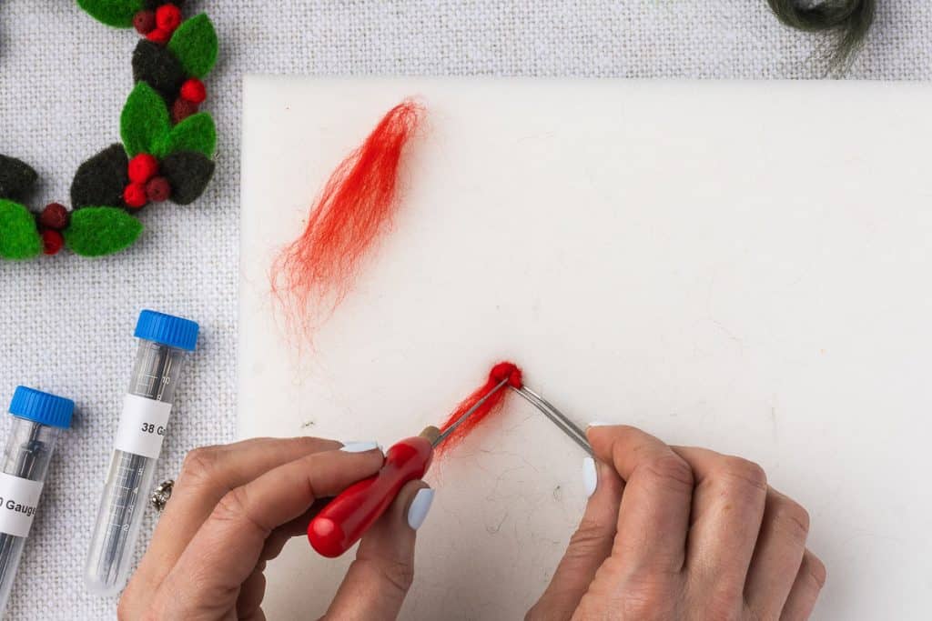 Red roving to make berry.