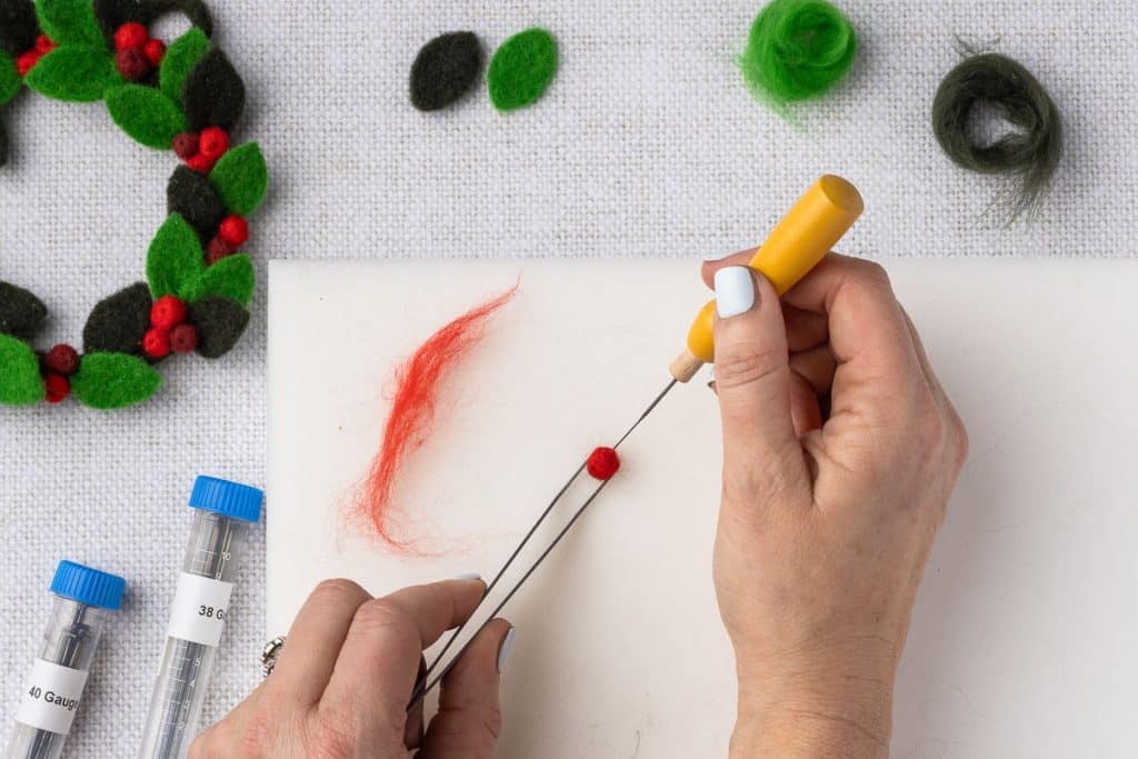 Red roving to make berry.