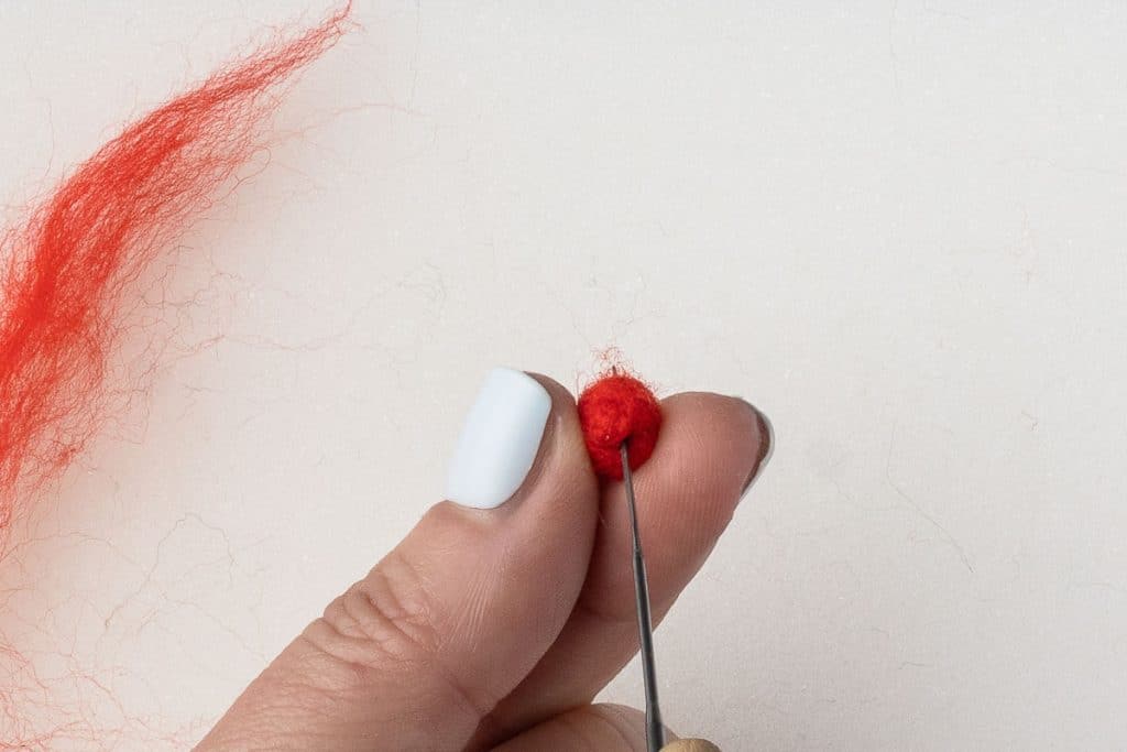 Red roving to make berry.