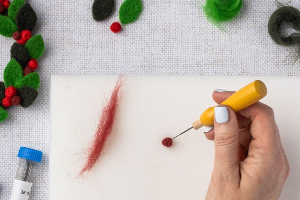 Red roving to make berry.