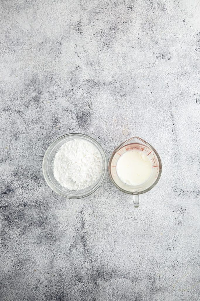 Milk and sifted powder sugar.