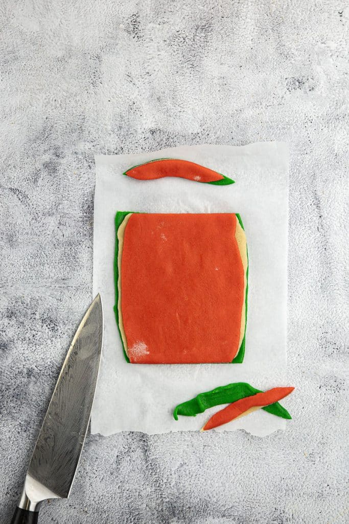 Evening up the rectangle of cookie dough.