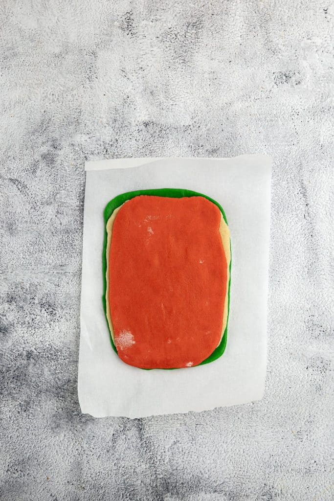 Three layers of colored cookie dough.