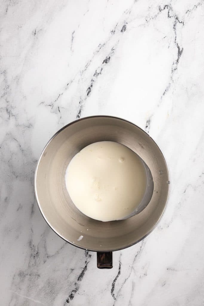 Whipping cream in a bowl.