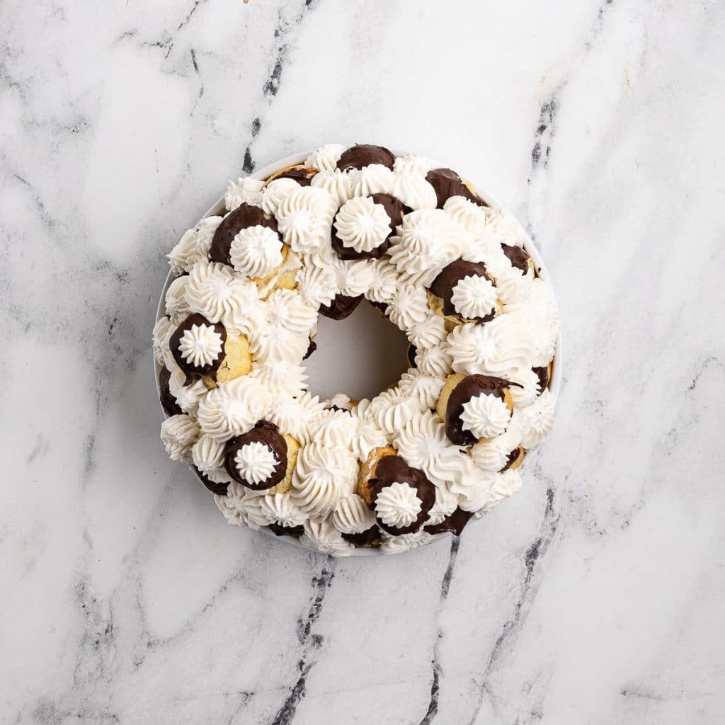 profiteroles with cream between them.